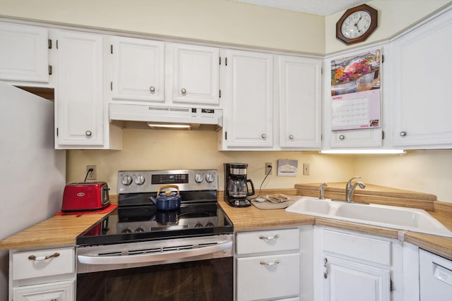 kitchen with appliances with stainless steel finishes, a sink, white cabinetry, and under cabinet range hood