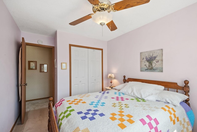 carpeted bedroom featuring a closet and a ceiling fan