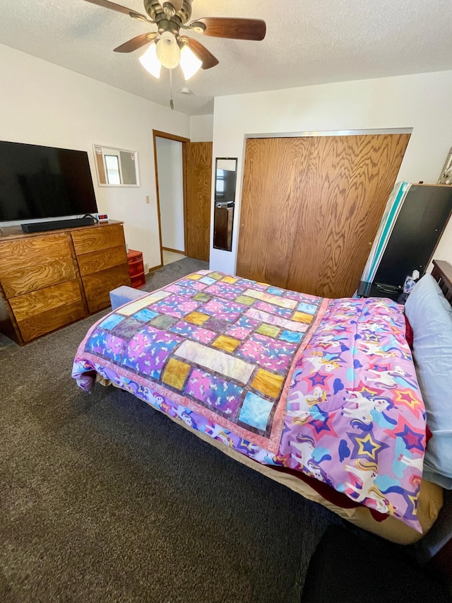 carpeted bedroom with a closet and a ceiling fan