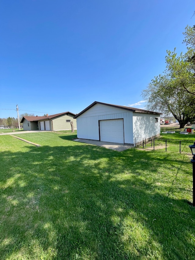 123 3rd St, Bluffton, MN 56518 - view of yard with an outbuilding, fence, and a detached garage
