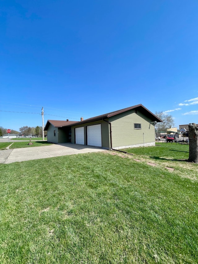 123 3rd St, Bluffton, MN 56518 - ranch-style home featuring a front yard, driveway, and a garage
