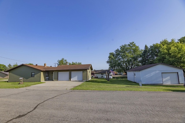 123 3rd St, Bluffton, MN 56518 - single story home featuring a front lawn, driveway, and an attached garage