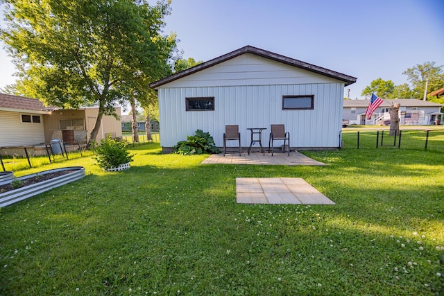 123 3rd St, Bluffton, MN 56518 - rear view of property featuring board and batten siding and a patio area