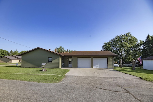 123 3rd St, Bluffton, MN 56518 - view of front of property with an attached garage, a front lawn, and driveway