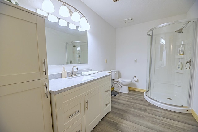 123 3rd St, Bluffton, MN 56518 - full bathroom with a stall shower, vanity, and wood finished floors
