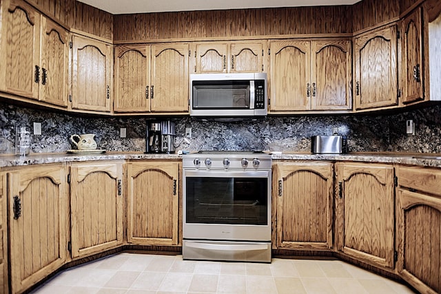 123 3rd St, Bluffton, MN 56518 - kitchen featuring appliances with stainless steel finishes and decorative backsplash