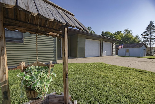 123 3rd St, Bluffton, MN 56518 - view of side of home with a lawn, a detached garage, and a shed