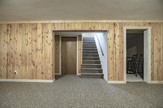 123 3rd St, Bluffton, MN 56518 - spare room with wood walls, carpet, stairs, and a textured ceiling