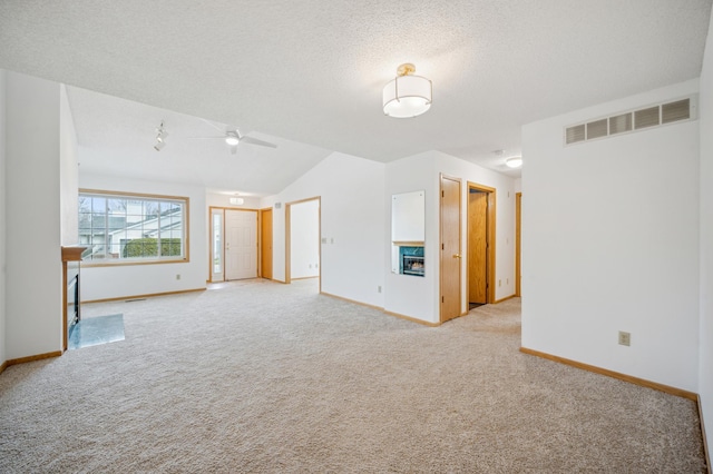 2786 87th St E Unit 18, Inver Grove Heights, MN 55076 - carpeted spare room featuring baseboards, vaulted ceiling, ceiling fan, and a textured ceiling