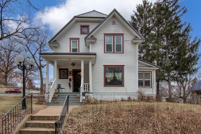 view of front of property featuring covered porch
