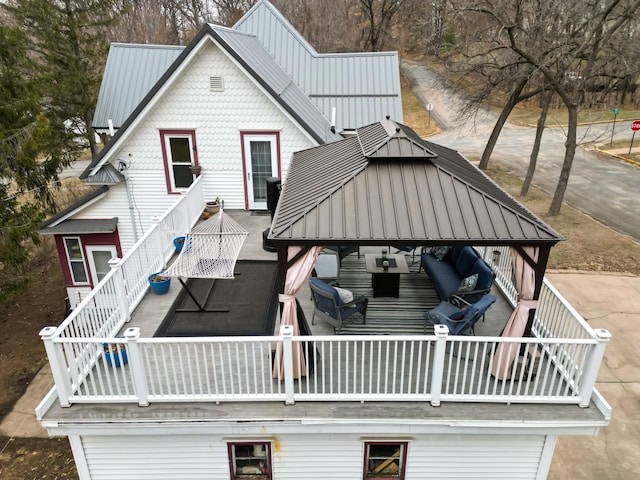 rear view of property with a balcony