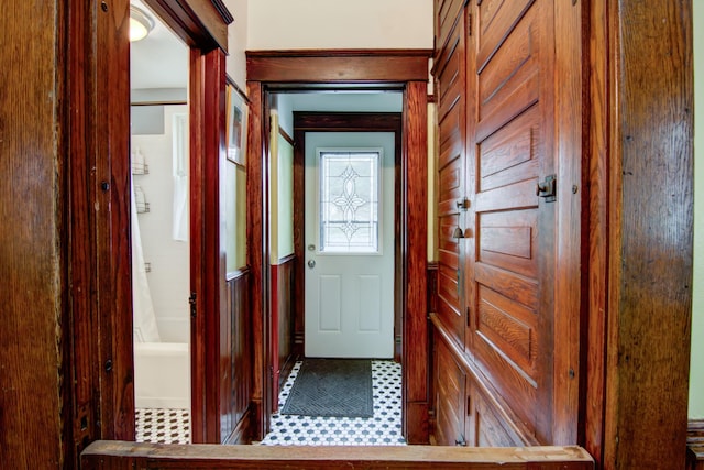 doorway to outside featuring tile patterned floors