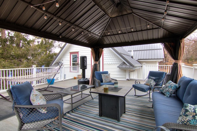 exterior space featuring a gazebo and outdoor lounge area