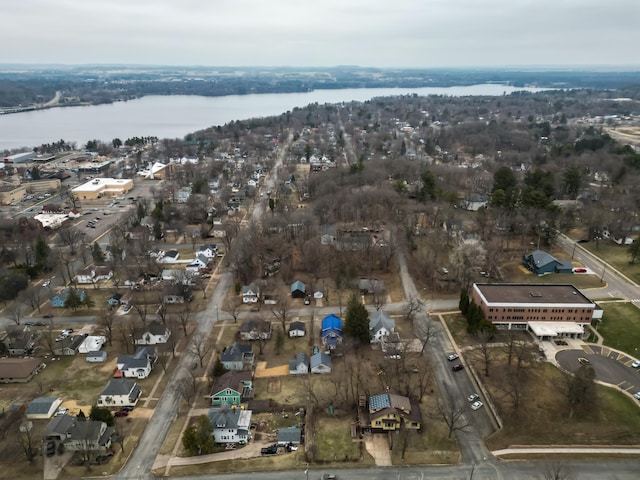 bird's eye view featuring a water view and a residential view