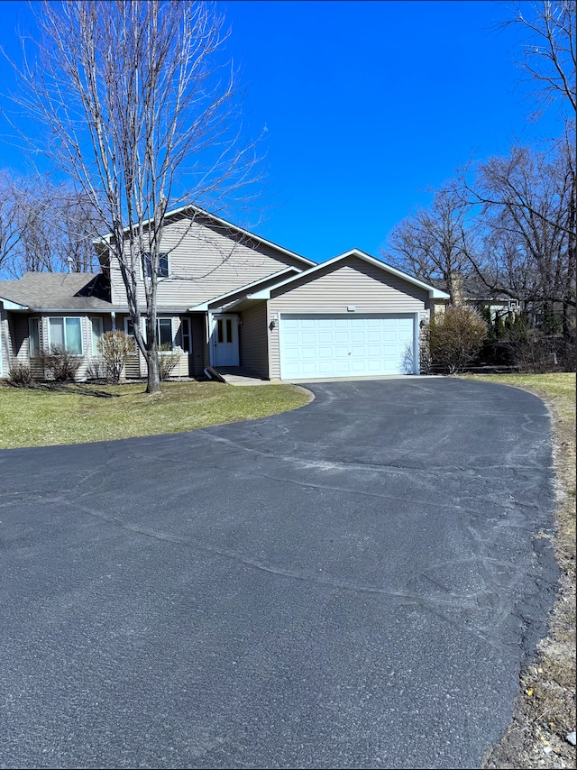 14132 Heywood Path, Apple Valley, MN 55124 - ranch-style home with a front lawn, a garage, and driveway