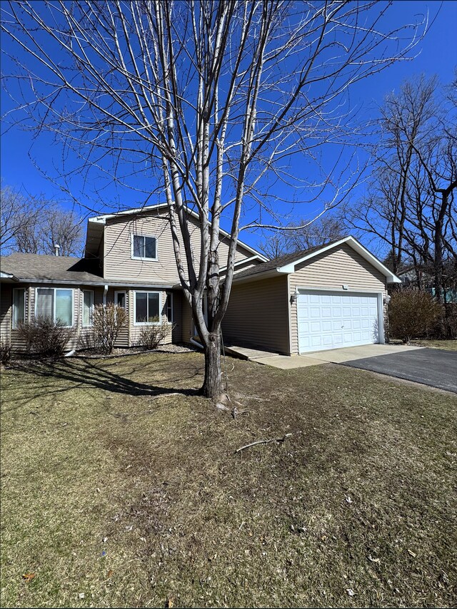 14132 Heywood Path, Apple Valley, MN 55124 - view of front facade featuring an attached garage and driveway