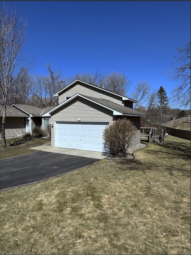 14132 Heywood Path, Apple Valley, MN 55124 - view of side of home with a garage, driveway, and a lawn