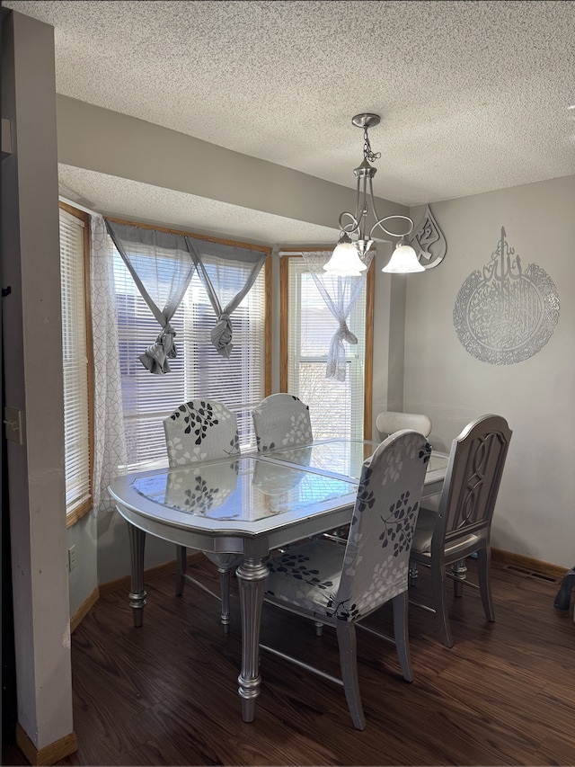 14132 Heywood Path, Apple Valley, MN 55124 - dining room with baseboards, plenty of natural light, wood finished floors, and a textured ceiling