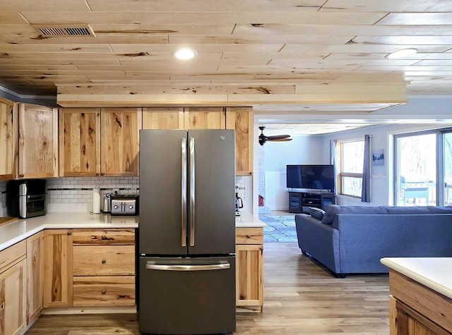 22004 Old Curry Rd SE, Cass Lake, MN 56633 - kitchen with freestanding refrigerator, wooden ceiling, light brown cabinetry, and light wood-type flooring