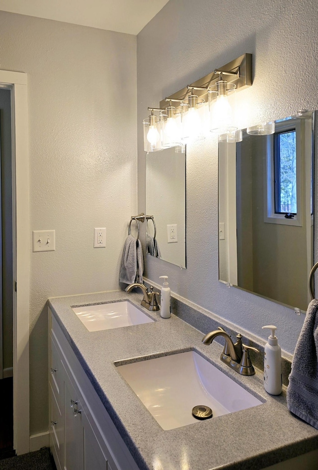 22004 Old Curry Rd SE, Cass Lake, MN 56633 - bathroom with double vanity and a textured wall