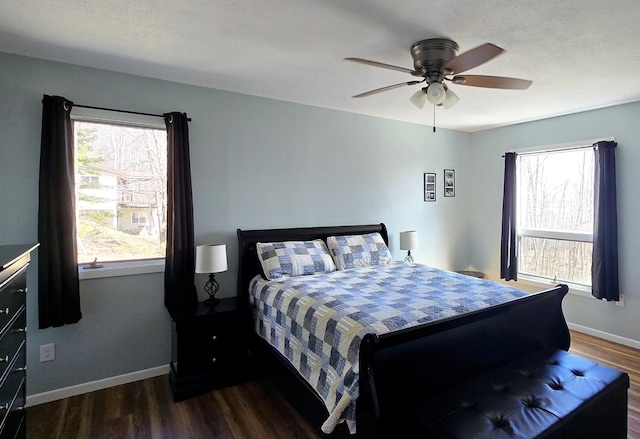 22004 Old Curry Rd SE, Cass Lake, MN 56633 - bedroom with dark wood-style floors, baseboards, and ceiling fan