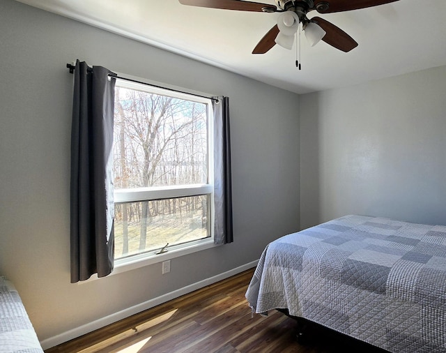 22004 Old Curry Rd SE, Cass Lake, MN 56633 - bedroom featuring dark wood-style floors, baseboards, and ceiling fan