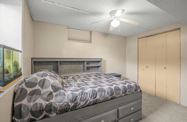 11799 191st Ave NW, Elk River, MN 55330 - bedroom with carpet, a closet, a textured ceiling, and ceiling fan