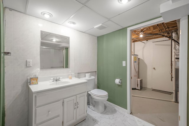 11799 191st Ave NW, Elk River, MN 55330 - bathroom with gas water heater, vanity, toilet, a shower, and marble finish floors