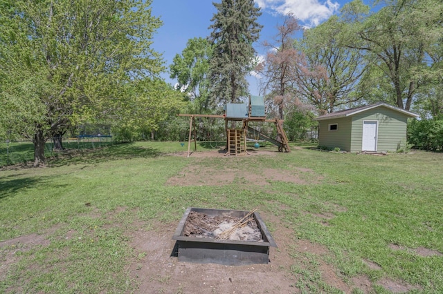 11799 191st Ave NW, Elk River, MN 55330 - view of green lawn with a playground and an outbuilding