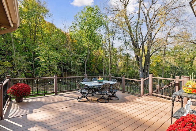 wooden deck with outdoor dining space