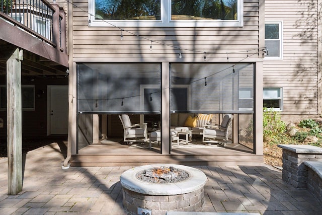 doorway to property featuring a patio area and an outdoor hangout area