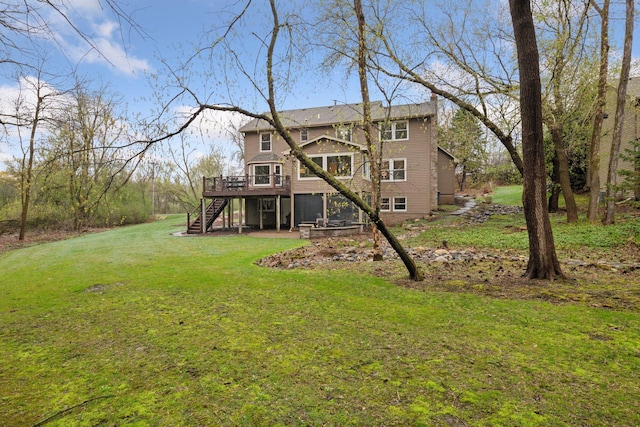 back of property with stairs, a yard, and a deck