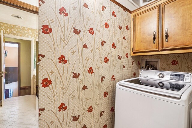 8621 Basswood Rd Unit 32, Eden Prairie, MN 55344 - laundry area featuring washer / clothes dryer, wallpapered walls, visible vents, and cabinet space