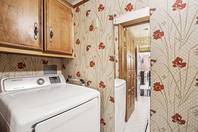 8621 Basswood Rd Unit 32, Eden Prairie, MN 55344 - washroom featuring washer / clothes dryer, light tile patterned floors, wallpapered walls, and cabinet space