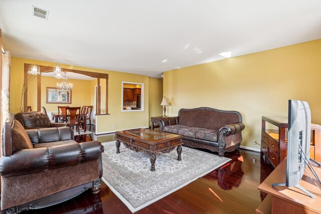 8621 Basswood Rd Unit 32, Eden Prairie, MN 55344 - living room featuring visible vents, baseboards, an inviting chandelier, and wood finished floors