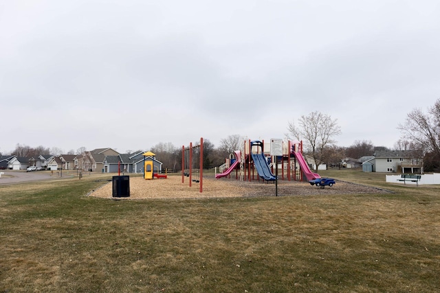 community play area with a yard and a residential view