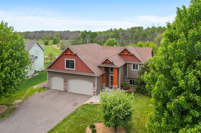 6387 203rd Ct N, Forest Lake, MN 55025 - craftsman-style house with stone siding, asphalt driveway, and a front lawn