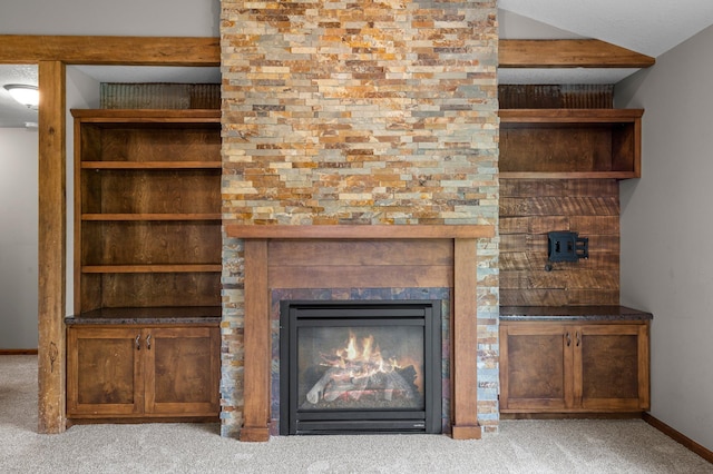 6387 203rd Ct N, Forest Lake, MN 55025 - detailed view of carpet flooring, baseboards, and a glass covered fireplace