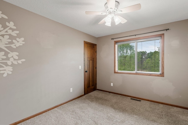 6387 203rd Ct N, Forest Lake, MN 55025 - carpeted spare room featuring baseboards and a ceiling fan