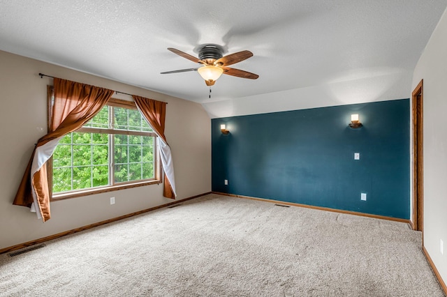 6387 203rd Ct N, Forest Lake, MN 55025 - carpeted empty room with ceiling fan, baseboards, and a textured ceiling