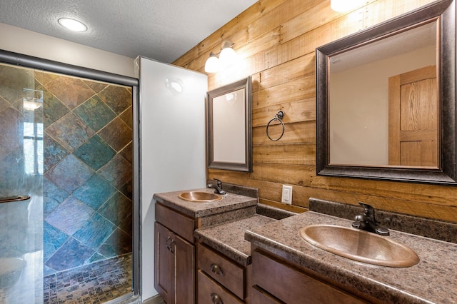 6387 203rd Ct N, Forest Lake, MN 55025 - bathroom with wood walls, two vanities, a stall shower, and a textured ceiling