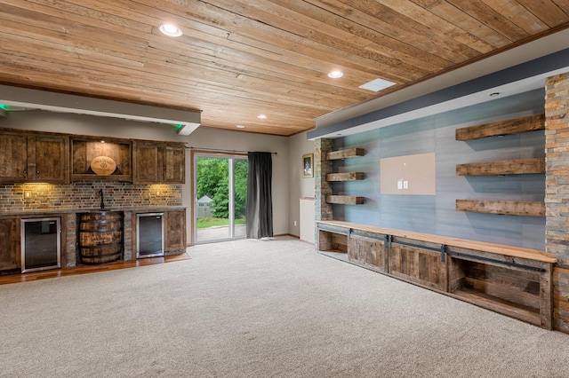 6387 203rd Ct N, Forest Lake, MN 55025 - unfurnished living room featuring wine cooler, wood ceiling, carpet flooring, recessed lighting, and a sink