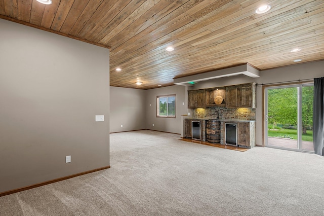 6387 203rd Ct N, Forest Lake, MN 55025 - unfurnished living room featuring wooden ceiling, light colored carpet, a fireplace, recessed lighting, and wine cooler