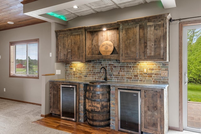 6387 203rd Ct N, Forest Lake, MN 55025 - indoor wet bar featuring beverage cooler, baseboards, and tasteful backsplash