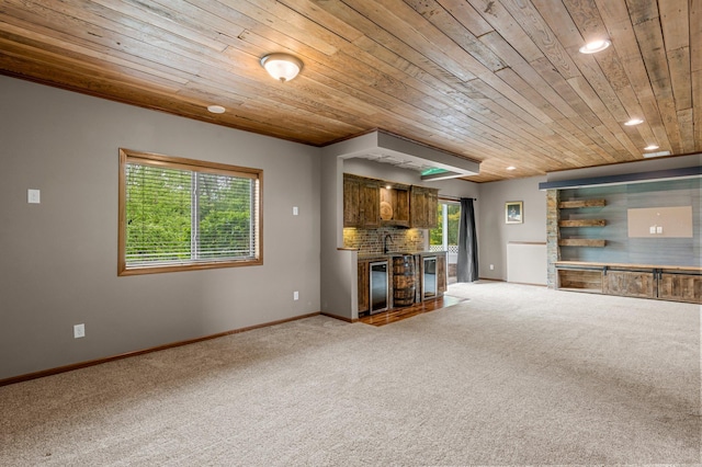 6387 203rd Ct N, Forest Lake, MN 55025 - unfurnished living room featuring wood ceiling, light carpet, healthy amount of natural light, baseboards, and recessed lighting