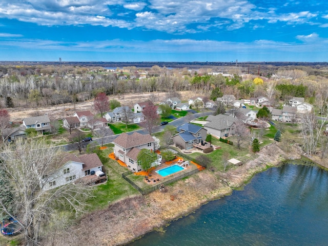 drone / aerial view with a residential view and a water view