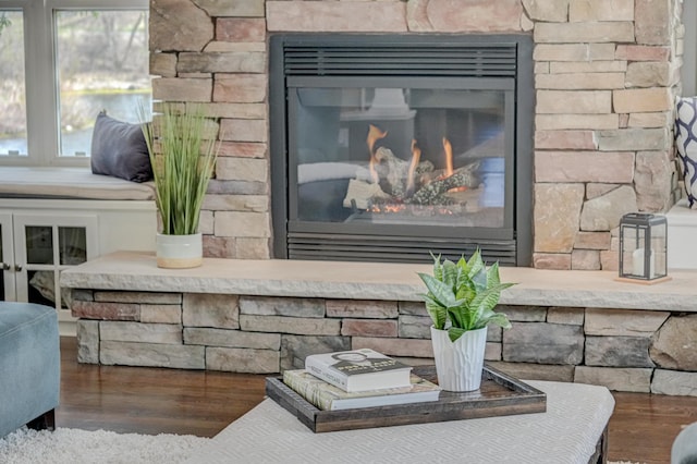 details with wood finished floors and a fireplace