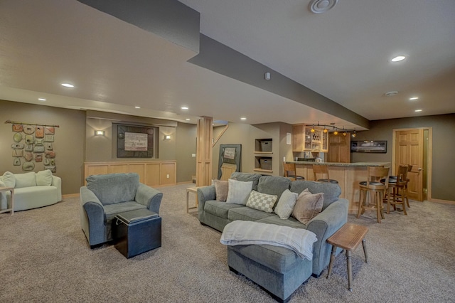 living area featuring recessed lighting, baseboards, light carpet, and bar