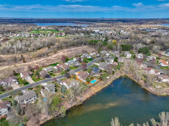 aerial view featuring a water view and a residential view
