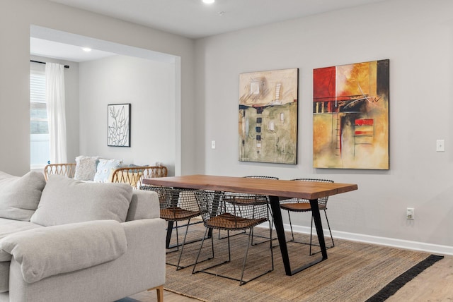 dining room featuring baseboards and wood finished floors